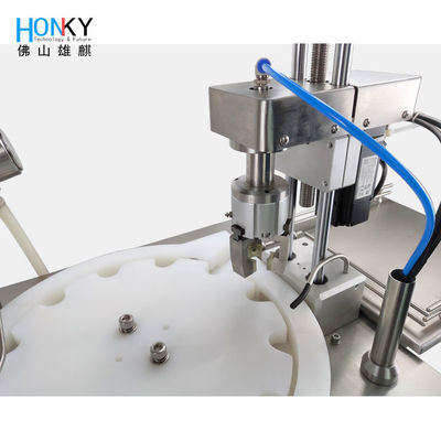 Máquina de llenado y tapado automático esencial de escritorio con sistema de tapado de servomotor para el embalaje de botellas de vidrio